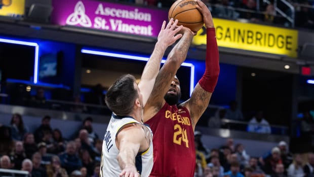 Mar 18, 2024; Indianapolis, Indiana, USA; Cleveland Cavaliers forward Marcus Morris Sr (24) shoots the ball while Indiana Pacers guard T.J. McConnell (9) defends in the second half at Gainbridge Fieldhouse. Mandatory Credit: Trevor Ruszkowski-USA TODAY Sports